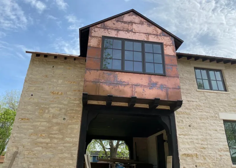 Copper metal panel facade on a stone building for Metal Roof Coating in Wenatchee