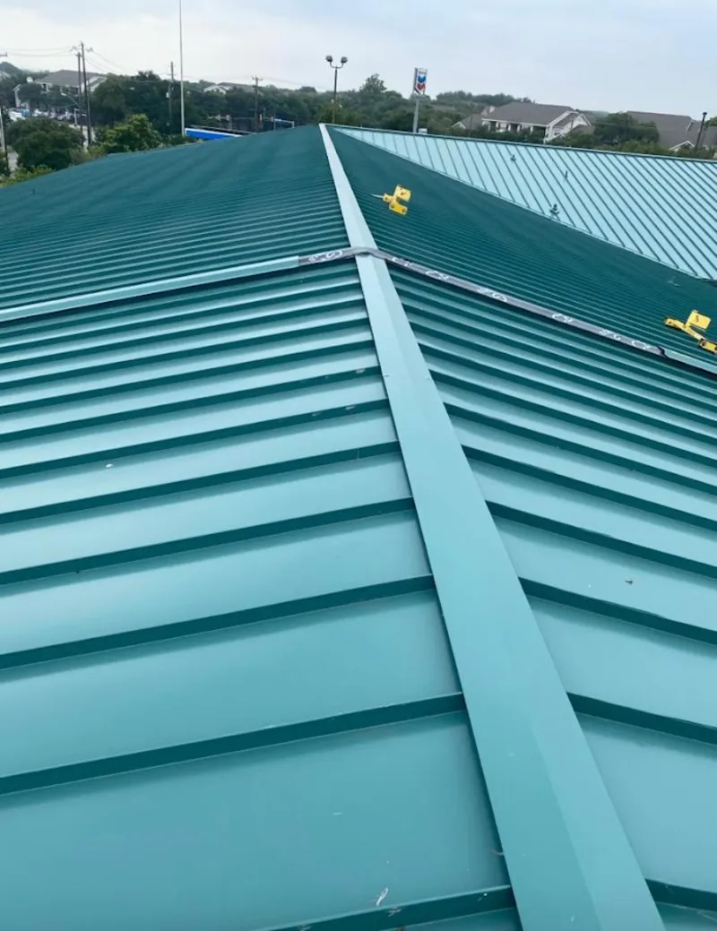 Green commercial metal roof ridge and valley for Metal Roof Repair in Wenatchee